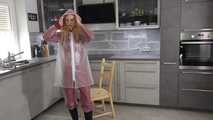 Miss Alice in Nylon rainsuit covered with transparent raingear