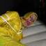 Get Pictures of Pia bound and gagged in her yellow shiny nylon Rainwear