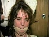 SWEET SHY HEATHER IS MOUTH STUFFED, ACE BANDAGE CLEAVE GAGGED, BAREFOOT, TOES TIED AND BOUND TO A CHAIR (D46-13)