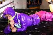 Pia wearing a pink rain pants and a purple down jacket tied with cuffs and gagged on bed (Pics) 