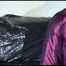 Watching Lucy preparing her sofa with a black shiny nylon cloth for lolling with a sexy purple downsuit on the sofa (Video)