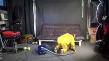 Watching sexy SANDRA vacuum cleaning the studio wearing a sexy yellow rainwear combination (Video)