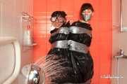 Anni Bay and Dakota - the pair in trash bags in the shower