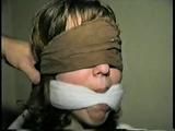 18 year old Heather IS MOUTH STUFFED, CLEAVE GAGGED, BLINDFOLDED, NYLON STOCKING GAGGED, TAPE GAGGED AND HANDGAGGED (D55-10)