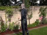 Watch Chloe gardening in her shiny nylon Rainwear