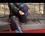 Jill putting on a sexy black downwear combination and blue rubber boots in an old cellar (Video)