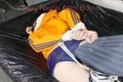 Lucy tied and gagged with ropes on a sofa wearing a sexy blue shiny nylon shorts and an orange rain jacket (Pics)