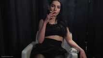Stunning Russian lady in black smoking two 100s in a row
