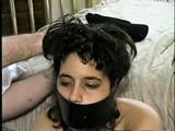 18 Yr OLD LATINA ZARR IS MOUTH STUFFED, LEATHER BELT GAGGED, BALL-GAGGED, OTM ACE BANDAGE WRAP GAGGED, WRISTS AND HANDGAGGED (D57-9)