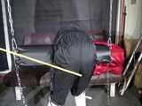 Watch Sandra beeing bound, gagged and spanked in her shiny nylon Rainsuit