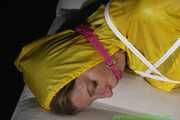 Get Pictures of Pia bound and gagged in her yellow shiny nylon Rainwear