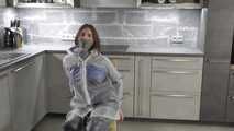 Miss J ziptied in raingear and gagged with stuffed mouth and secured clave gag