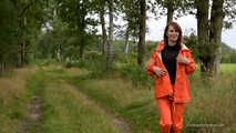 Miss Petra takes a walk in a orange AGU rain suit and rubber boots