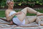 Watching Sonja wearing a hot white shiny nylon shorts and a white top bound herself and gag herself in the garden (Pics)