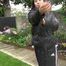 Watching Aiyana wearing a sexy black shiny nylon rainpant and a black shiny nylon down jacket trying the garden shower  (Video)