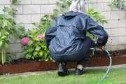 Watch Chloe enjoying her shiny nylon Rainwear doing some watering in the garden