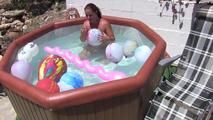 a jakuzzi full of balloons