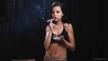 Sexy brunette is smoking two all white 120mm cigarettes wearing an underwear