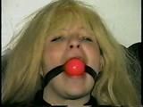 SEXY BOMBSHELL TRACY BALL-GAGS HERSELF, IS MOUTH STUFFED & HANDGAGED (D38-10)