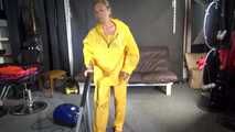 Watching sexy SANDRA vacuum cleaning the studio wearing a sexy yellow rainwear combination (Video)