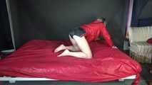 Watching sexy Sonja during preparing the bed wearing sexy black shiny nylon shorts and a red rain jacket (Video)