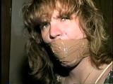 28 YEAR OLD HOUSEWIFE IS MOUTH STUFFED, WRAP TAPE GAGGED, TOE-TIED,  BLINDFOLDED, and HOG-TIED (D57-14)