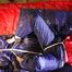 Sonja tied, gagged and hooded on bed with cuffs, chains and a gag wearing a sexy blue shiny nylon rain pants and a red rain jacket (Pics)