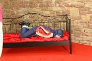Mara tied, gagged and hooded on a princess bed wearing sexy oldschool downwear in blue/red/white (Pics)