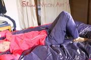 Sonja lolling on bed with a sexy blue rain pants and a red rain jacket enjoying herself and the hood in this material (Pics)