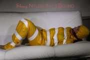 Watching Pia being tied and gagged with tape and a cloth gag wearing sexy yellow shiny nylon rainwear (Pics)