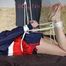 Sexy Pia being tied and gagged on a sofa with ropes and a cloth gag wearing a sexy darkblue shiny nylon shorts and a blue/red rain jacket (Pics)