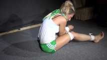 Sexy Sandra being tied and gagged on the floor wearing a sexy green shiny nylon shorts and a white top (Video)